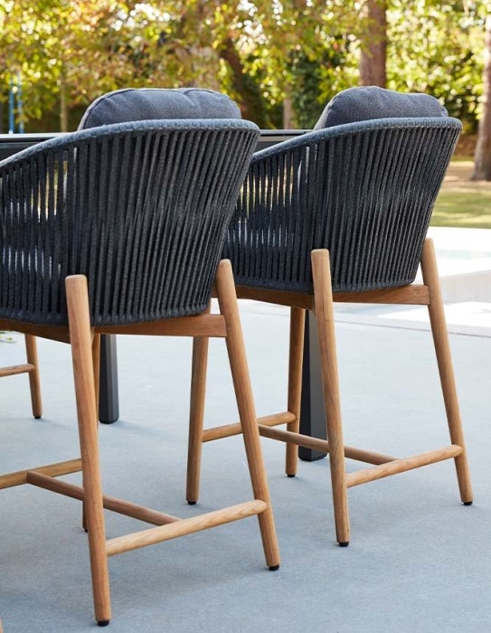 Outdoor barstools in teak and rope on terrace