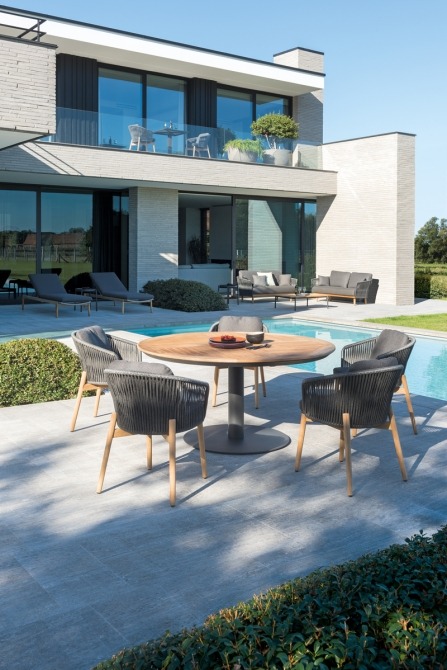 Alexa round dining table with Newport armchairs on terrace by the pool