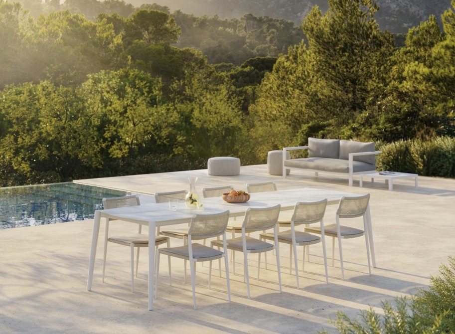 Icon dining table in ceramic in terrace by the pool