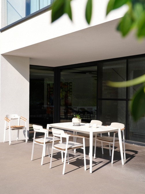 Icon dining table and armchairs on terrace