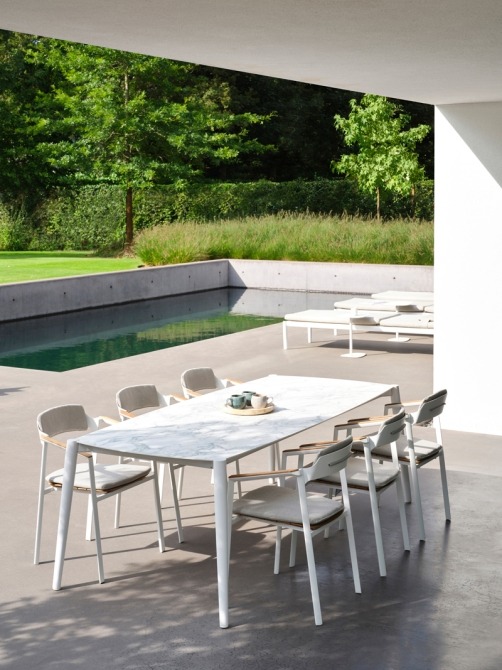 Icon dining table and armchairs on terrace