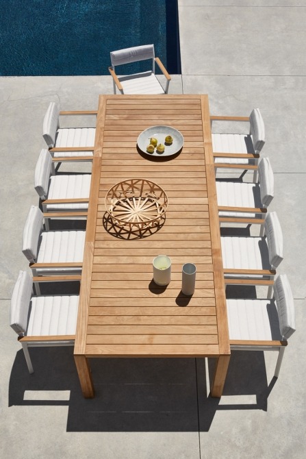 Natural teak dining table on terrace