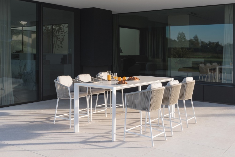 Omer barstools at high dining table on terrace