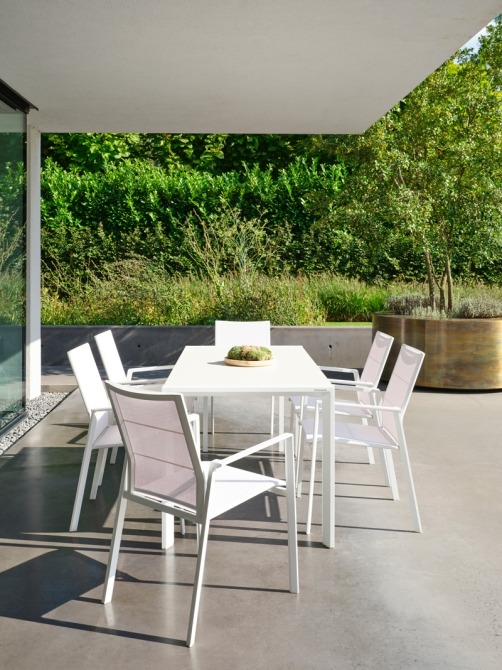 outdoor ceramic dining table with batyline chairs in white