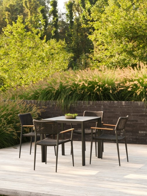 outdoor ceramic dining table with batyline chairs in black